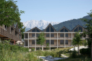 Altes Garmisch neu gelebt - Gemeinschaftlicher Innenhof mit Grünanlage zwischen den Holzgebäuden